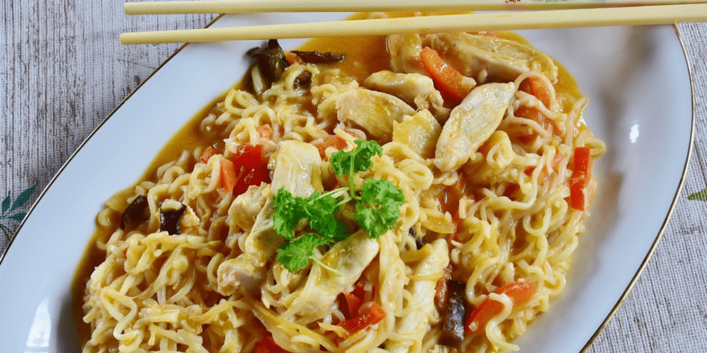 Delicious bowl of Creamy Chicken Noodles garnished with fresh herbs, perfect for the Creamy Chicken Noodles Recipe